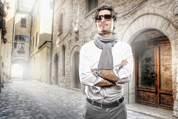 Stylishly dressed man on the street of the ancient city