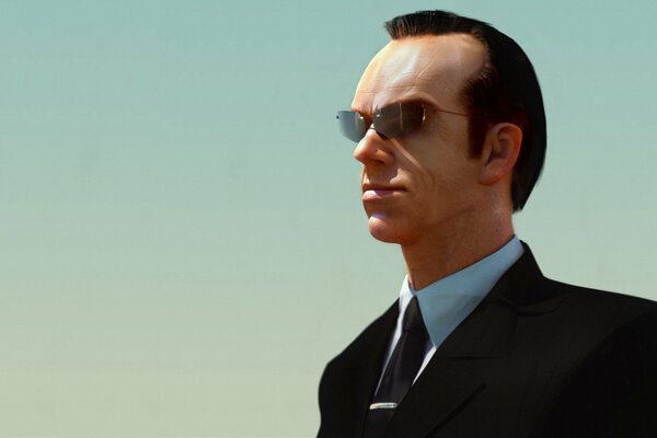 Agent Smith a okularach i czarnym garniturze