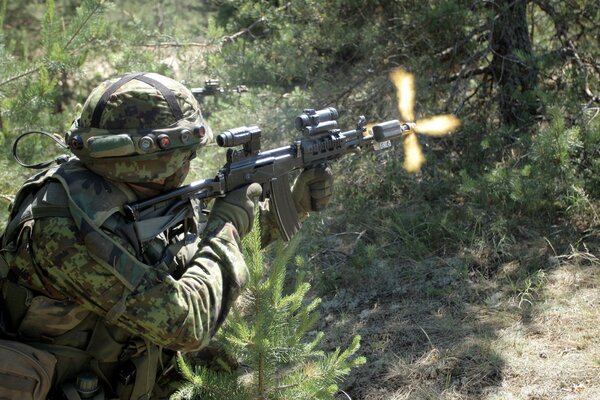 An Estonian army soldier is firing