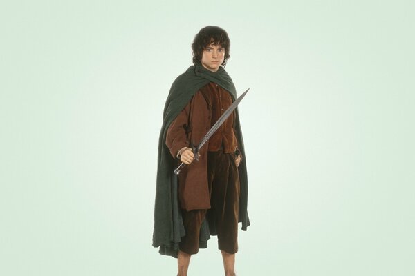 Elijah Wood como el Hobbit Frodo baggins sobre fondo blanco