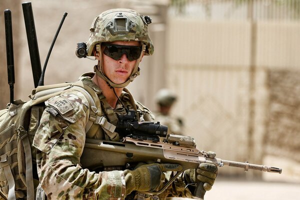 Uniforms of an Australian soldier with a gun