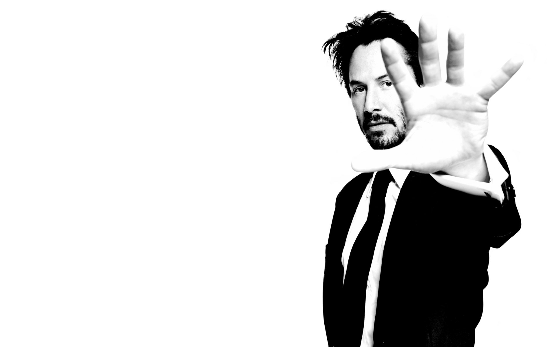 keanu reeves homme main noir et blanc