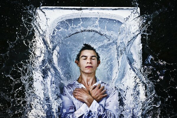 A peaceful guy in the bathroom with water