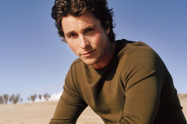 Christian Bale and the beach are the perfect combination