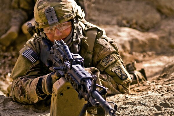 A soldier with a gun in a trench