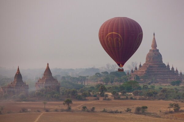 A balloon is flying in an ancient city