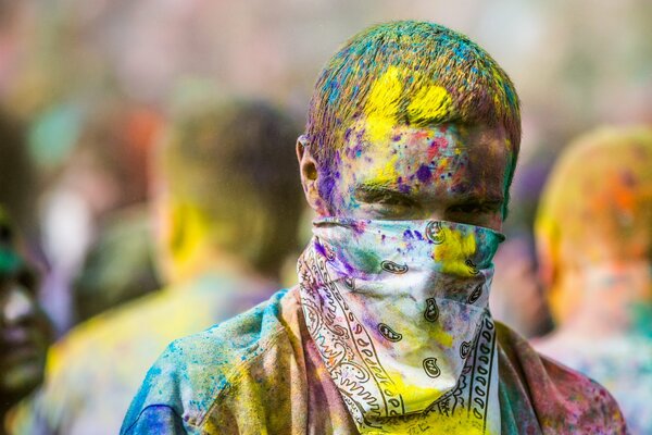 A man in a bandana at the festival of colors