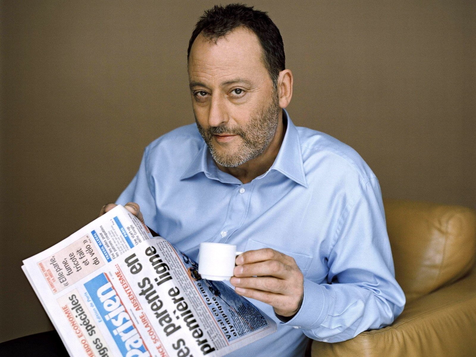 jean reno newspapers cup coffee