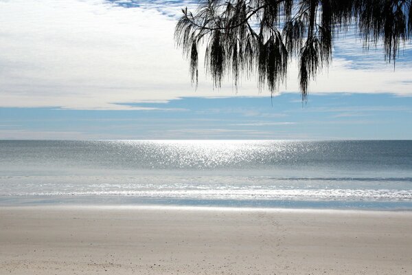 The sea is like a mirror reflecting the clouds brilliantly