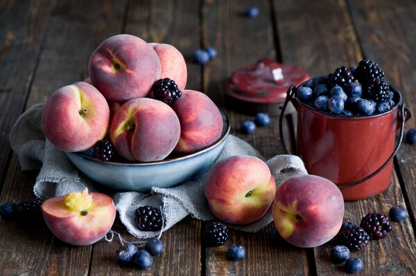 Peaches in a cup with hedgehogs and blueberries