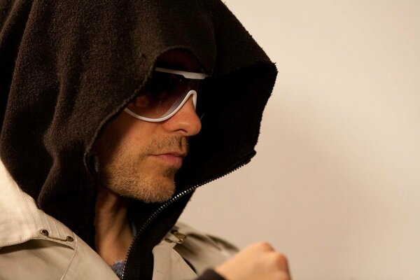 Jared Leto in a hood and glasses