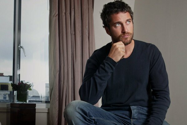 Gerard Butler by the window