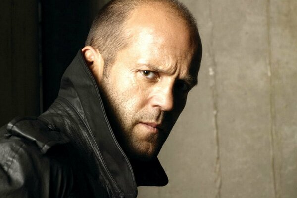 Portrait of Jason Statham with piercing eyes