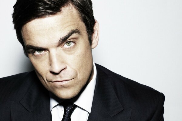 Robbie Williams in a classic suit