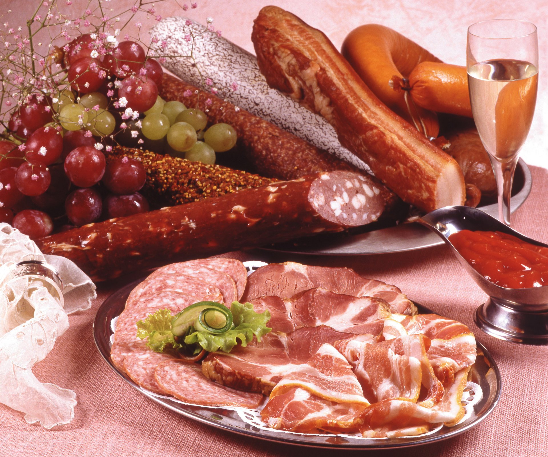 meat products sausage ham champagne grapes glasses food photo