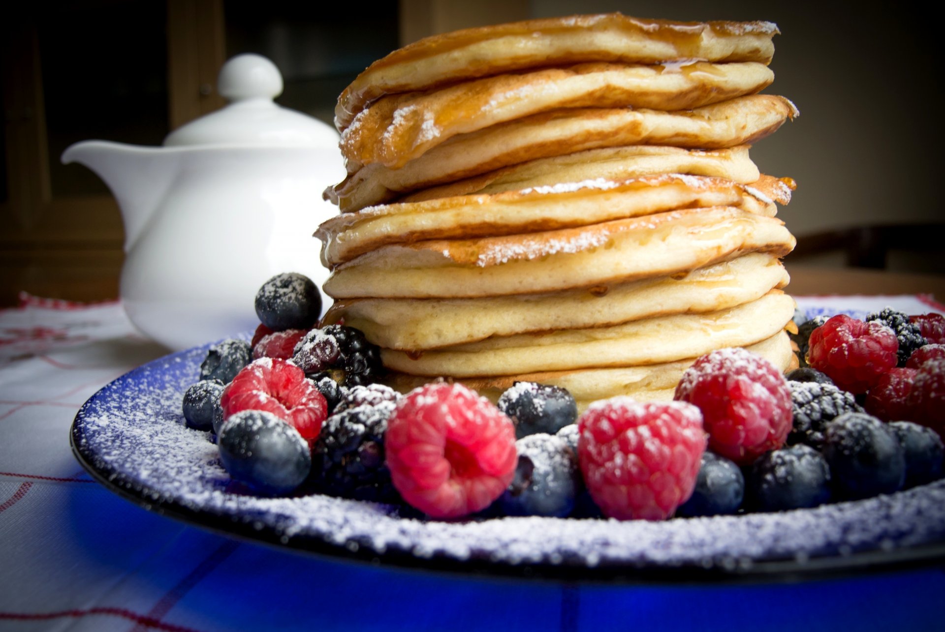 pancakes pancakes berries raspberries blueberries blueberries blackberries sugar powder