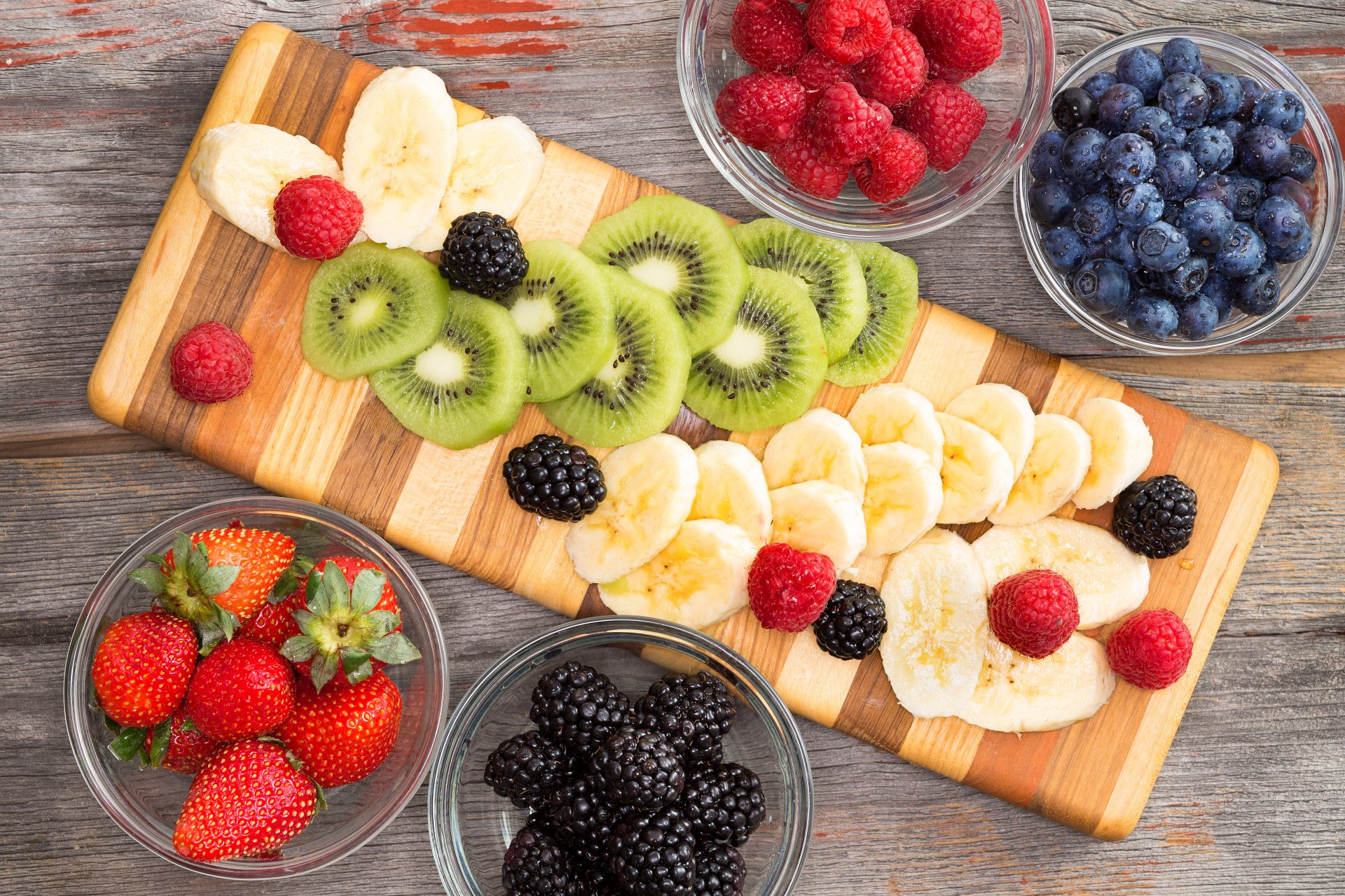 fruit slicing fruits berries blueberries strawberries raspberries blackberries banana kiwi fruit meats raspberrie