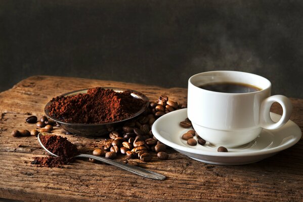 Photo of a cup of coffee with beans