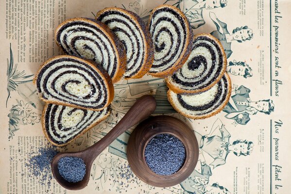 Still-life. Sliced sweet roll with poppy seeds