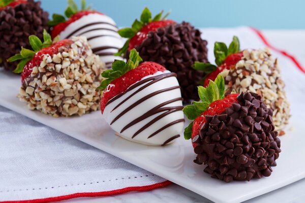 Fresh cowberry in chocolate with nuts