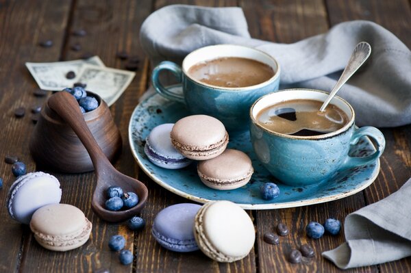 Macaroons with blueberries and coffee