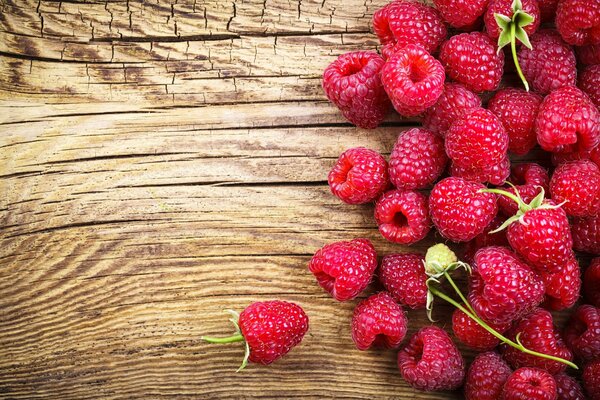 Raspberries lying on the wood