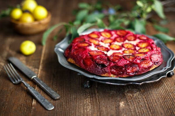 Ready plum pie on the table