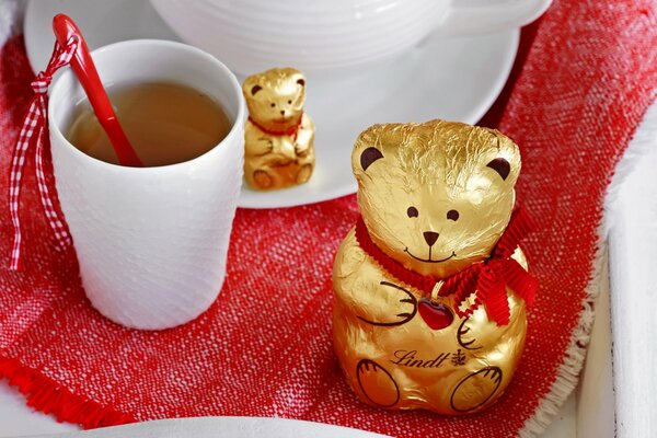 Chocolate bears with a mug of tea in a cozy atmosphere