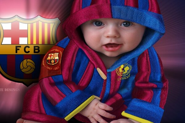 A little fan of FC Barcelona. The child is a fan