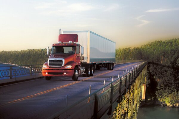 Freightliner truck rides on the bridge