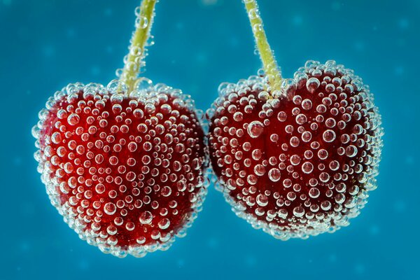 Macro cherry in water with small bubbles