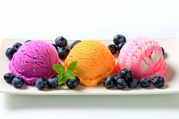 Multicolored berry ice cream with blueberries