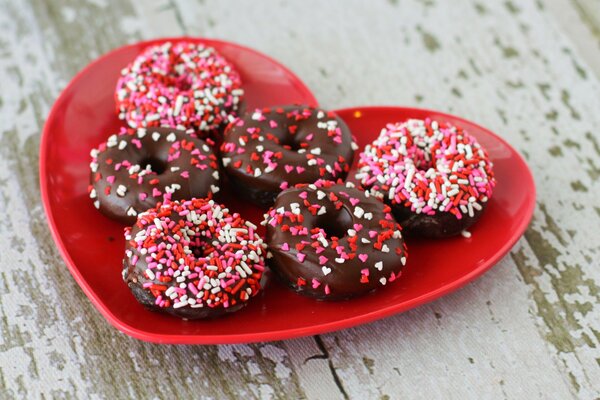 Donuts with bright sprinkles on a plate