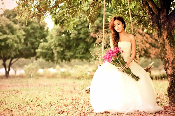 Chica en vestido de novia con flores