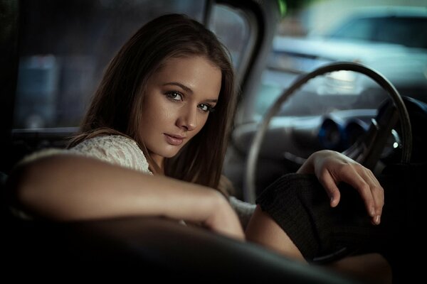 Portrait of a beautiful girl Natasha driving a car