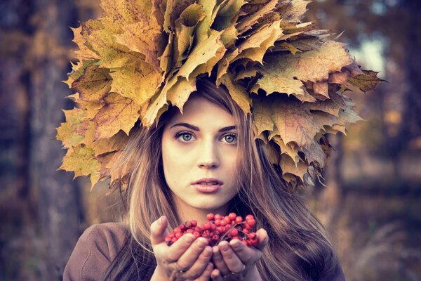 Beautiful girl in a wreath of leaves