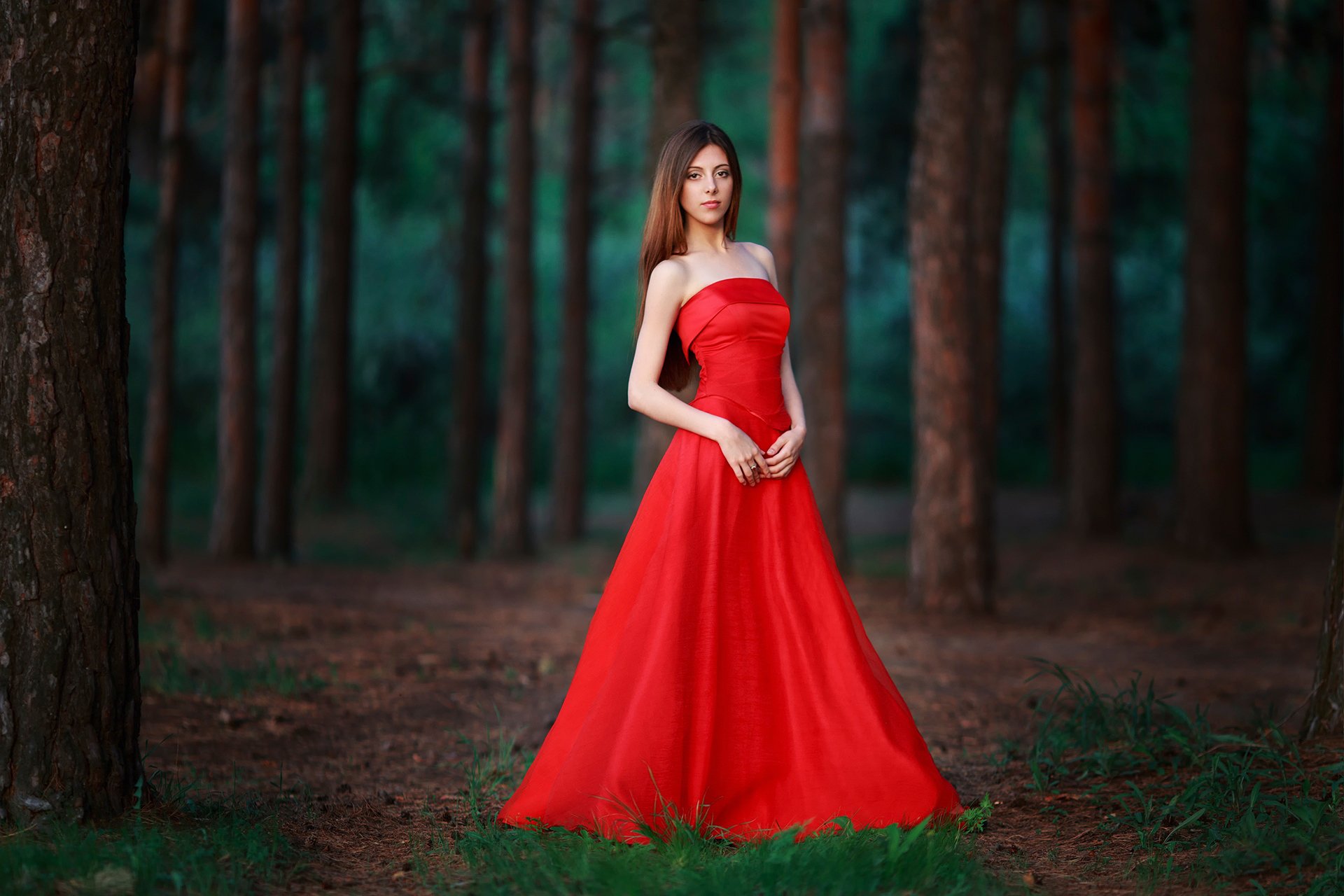 lady in red in red forest figure view