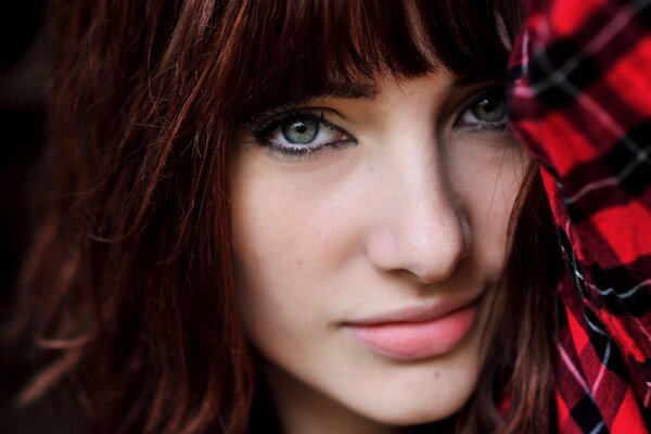 Cute redhead girl in shirt close-up