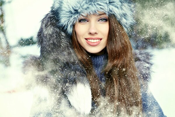 Cheerful winter portrait of a girl