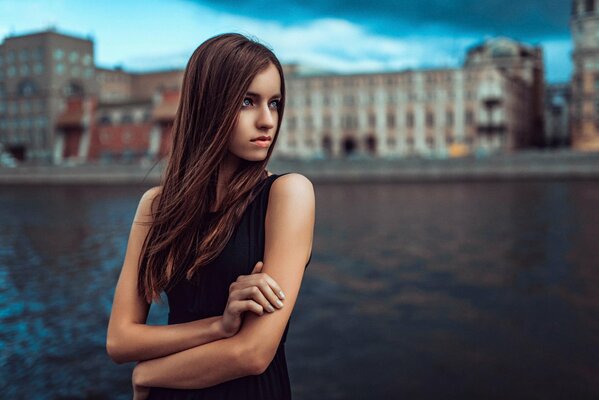 Girl on the background of the river