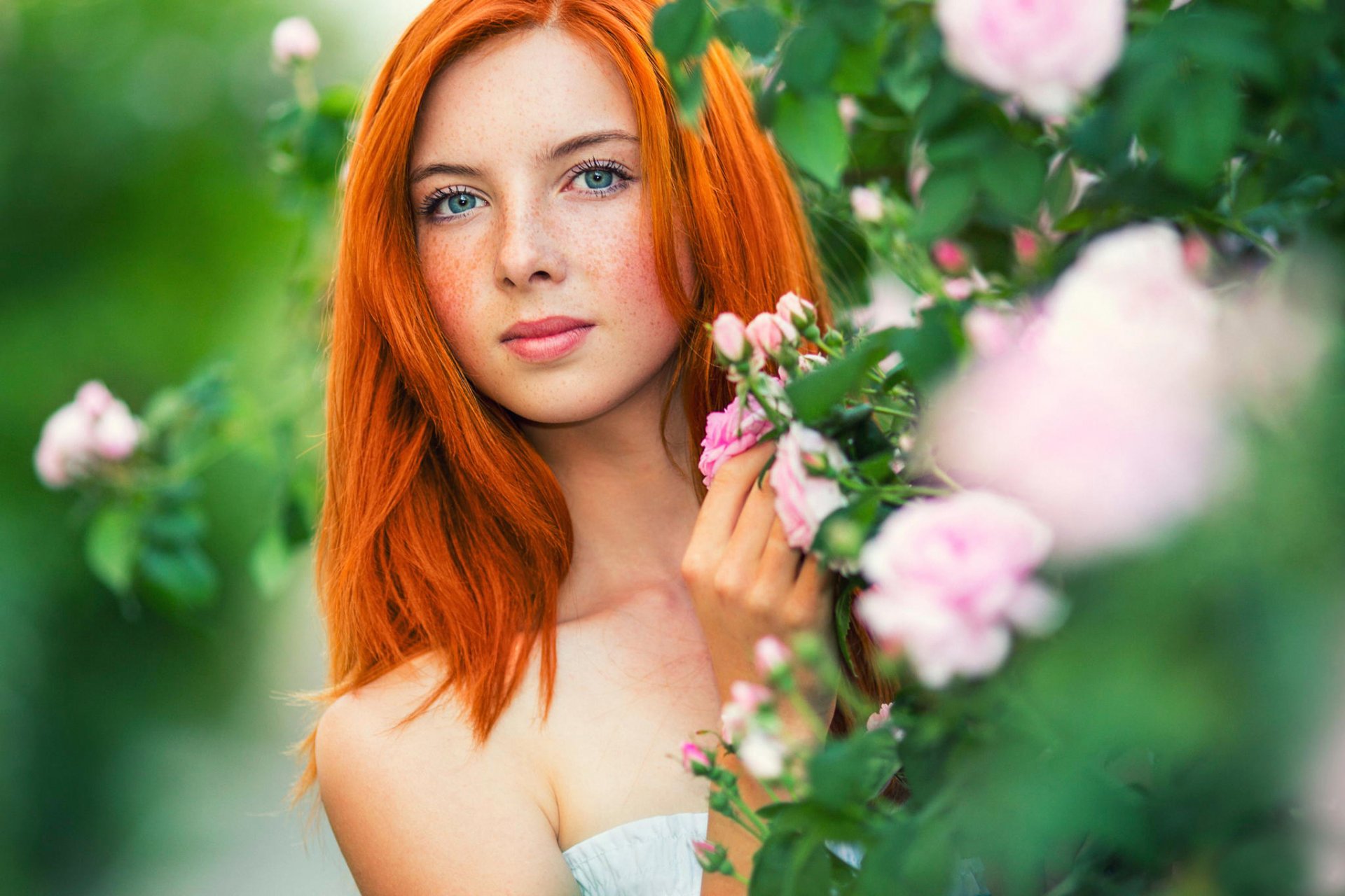 red hair freckles portrait flower