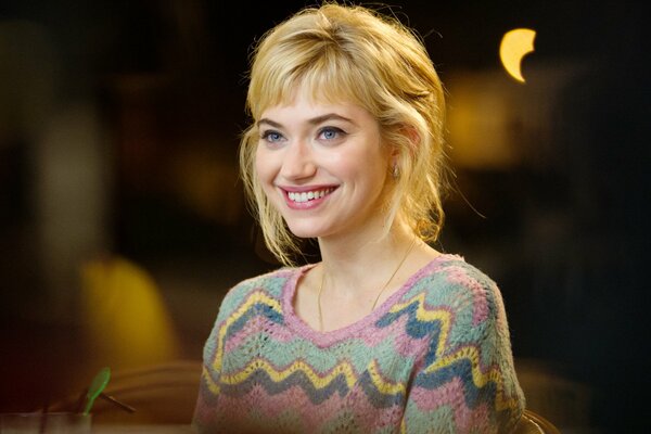 Happy blonde in a knitted sweater