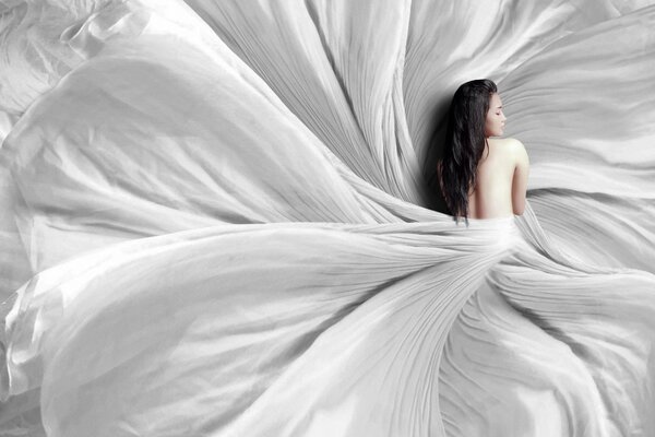 Naked girl on the background of the bed