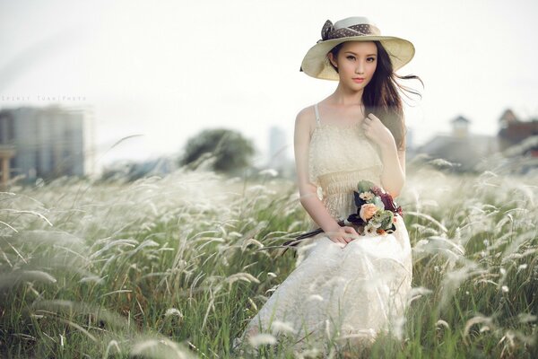 Fotoshooting für asiatische Mädchen im Feld