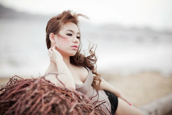 A beautiful Korean woman looks into the distance