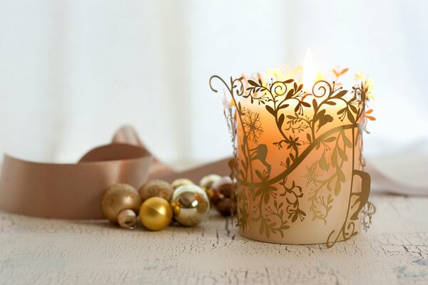 New Year s golden candle with balls