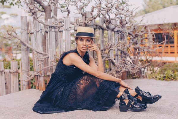 A girl in a stylish black dress