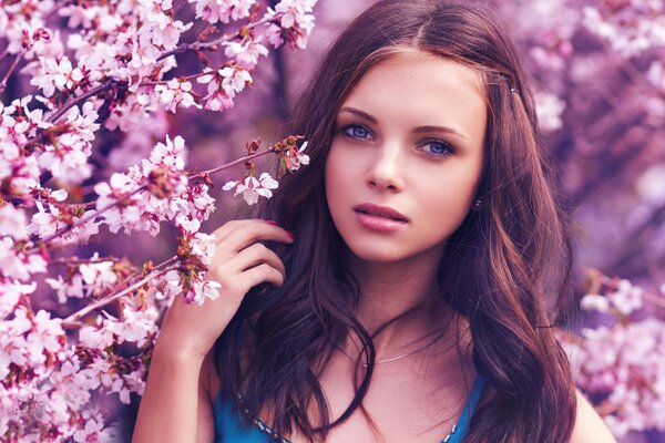 Portrait of a girl with blue eyes in spring