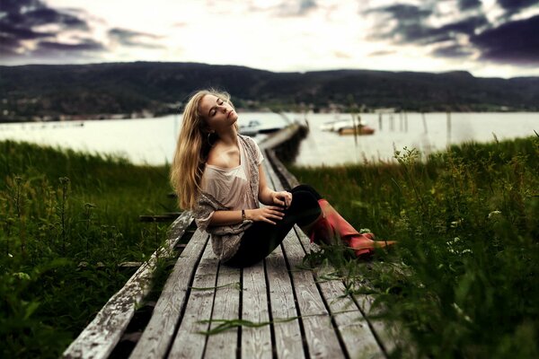 A girl near the lake. Romantic mood