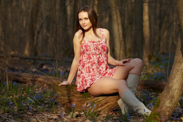 A girl poses in summer in nature